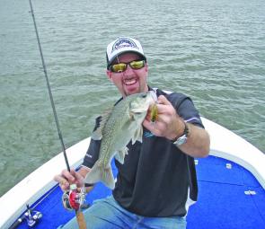 Chris Galligan shows that crankbaits fished around shallow bottom formations can produce quality bass.